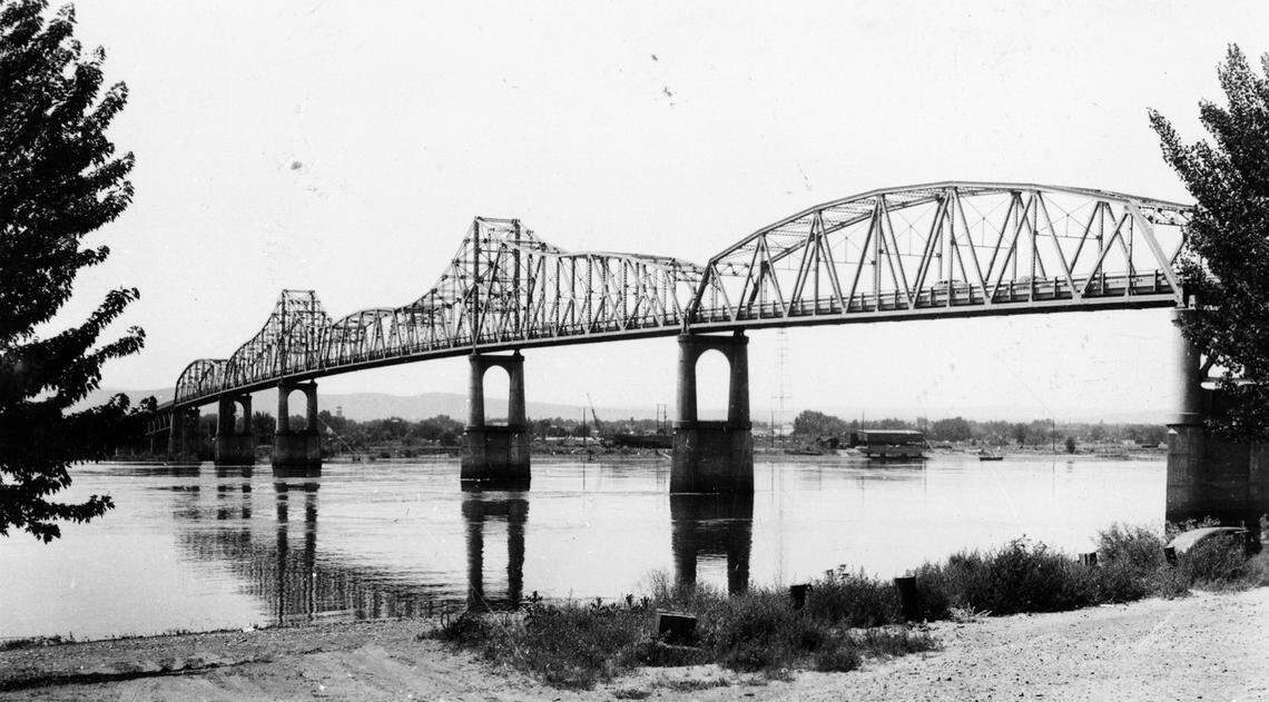 A 1948 view of the green bridge over the Columbia River linking Kennewick and Pasco, which was built in 1922 to complete the northern route of the transcontinental highway from the east to west coast.
