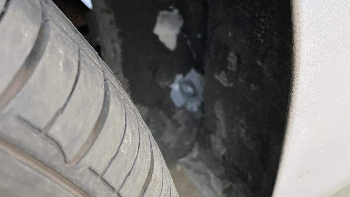 A bullet in a drive-by shooting hit the wheel well of a car on Highway 395.