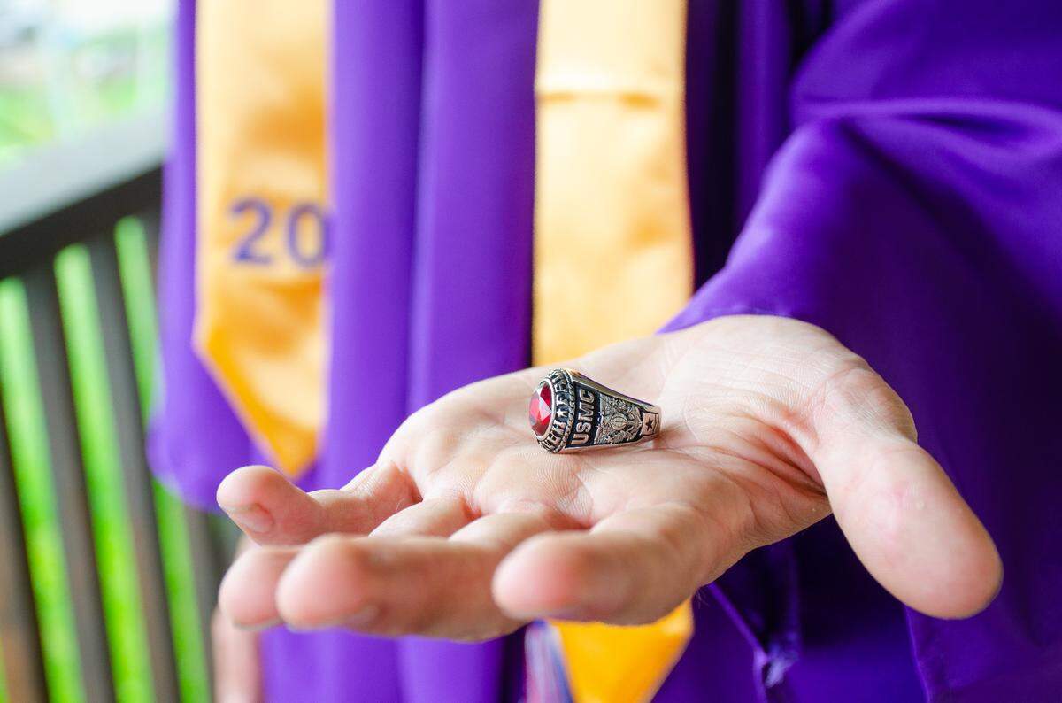 Hanford High School graduate Austin Mallory shows off his graduation ring with a U.S. Marine Corps design carved into the side.