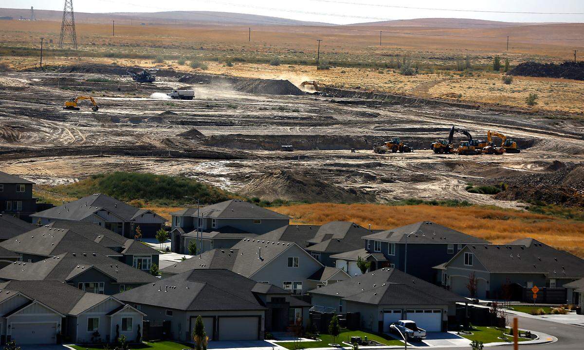 Earth moving equipment clears the way for future streets and residential lots off South Colorado Street near West 28th Place off the Bob Olson Parkway in the Southridge area of Kennewick.
