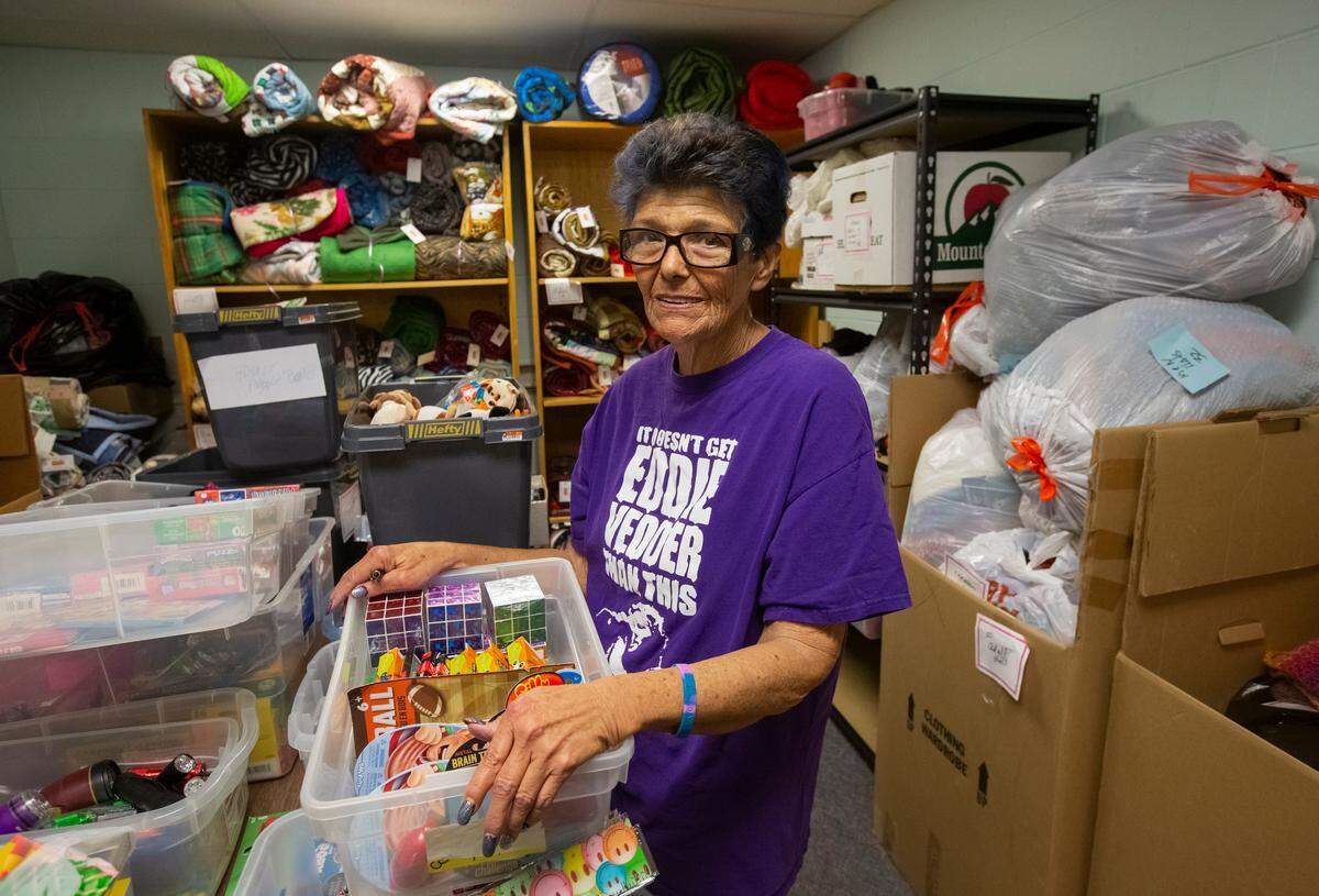 Holli Calder-Cox stands inside Project Warm-Up headquarters at Community Action Connections in Pasco.