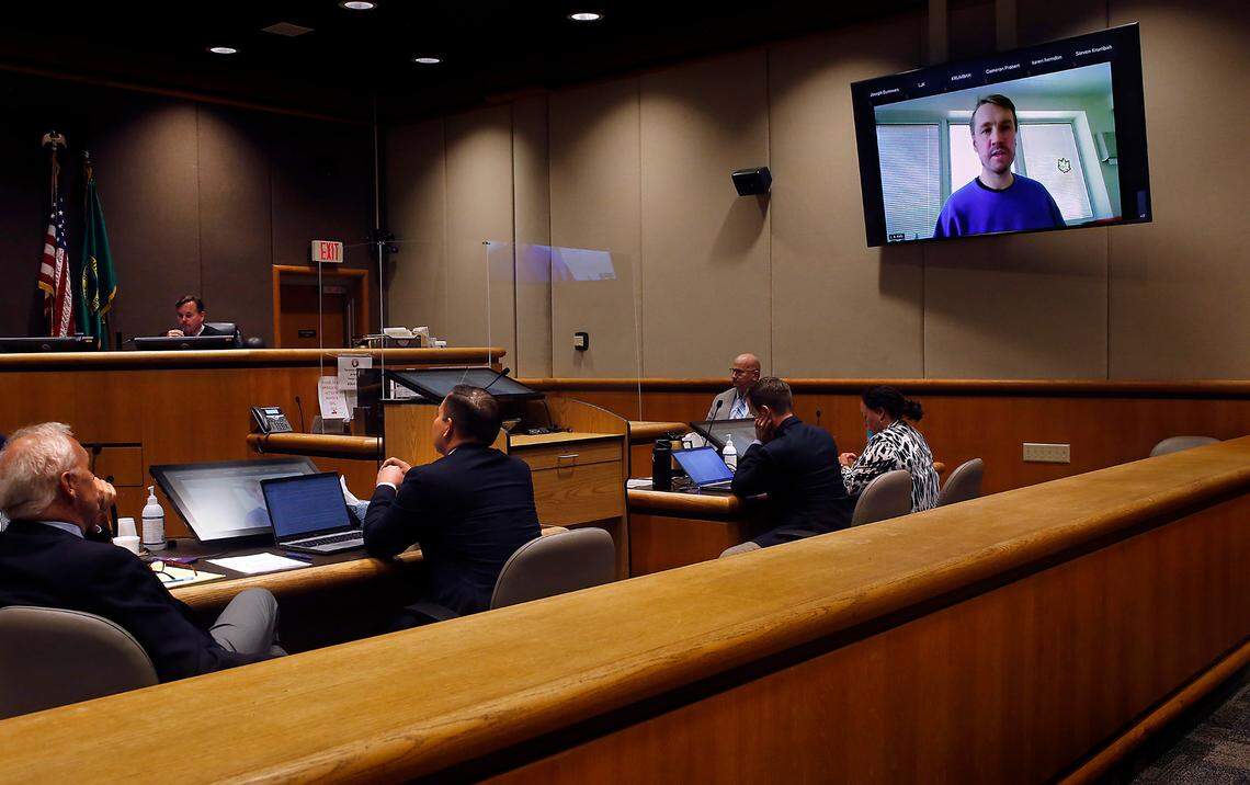 Aaron Kelly, who is accused of shooting two men inside the Richland Fred Meyer store in February 2022, objects to Judge Joe Burrowes during a court hearing in Kennewick.
