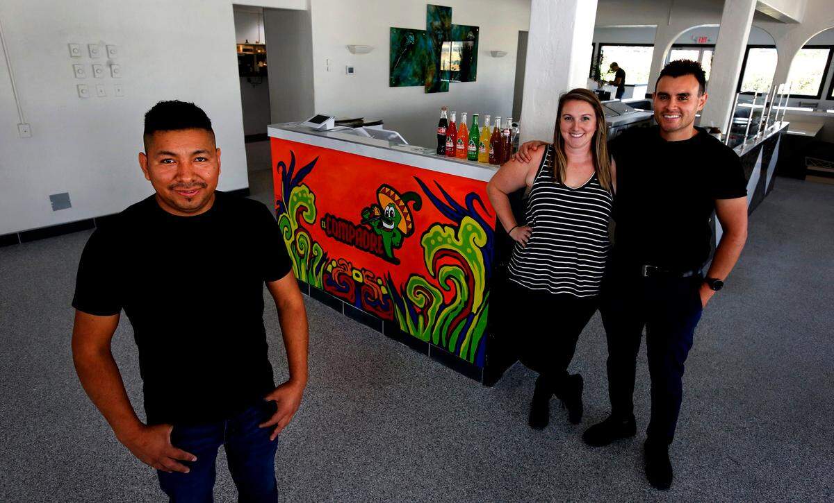 Jackie Avelar and her husband, Adalberto, at right, have joined forces with Marvin Figueroa to open the Crepe Haus restaurant and El Compadre mexican restaurant in Richland. 