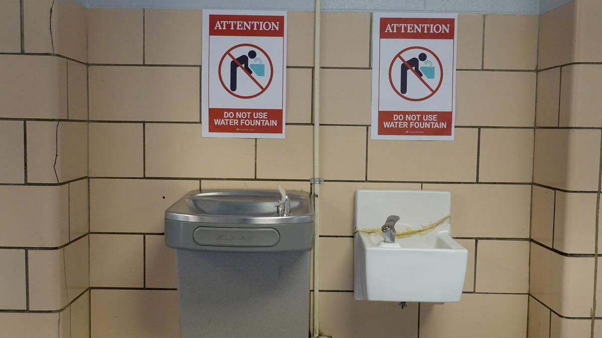 CHICAGO, ILLINOIS - SEPTEMBER 08: Signs above the drinking fountains at King Elementary School discourage their use as the school works to maintain a safe environment during the coronavirus pandemic on September 08, 2020 in Chicago, Illinois. Students at King Elementary and the rest of Chicago public schools started classes today remotely because of COVID-19 concerns. Teachers have the option of teaching from home or from their classrooms.  (Photo by Scott Olson/Getty Images)