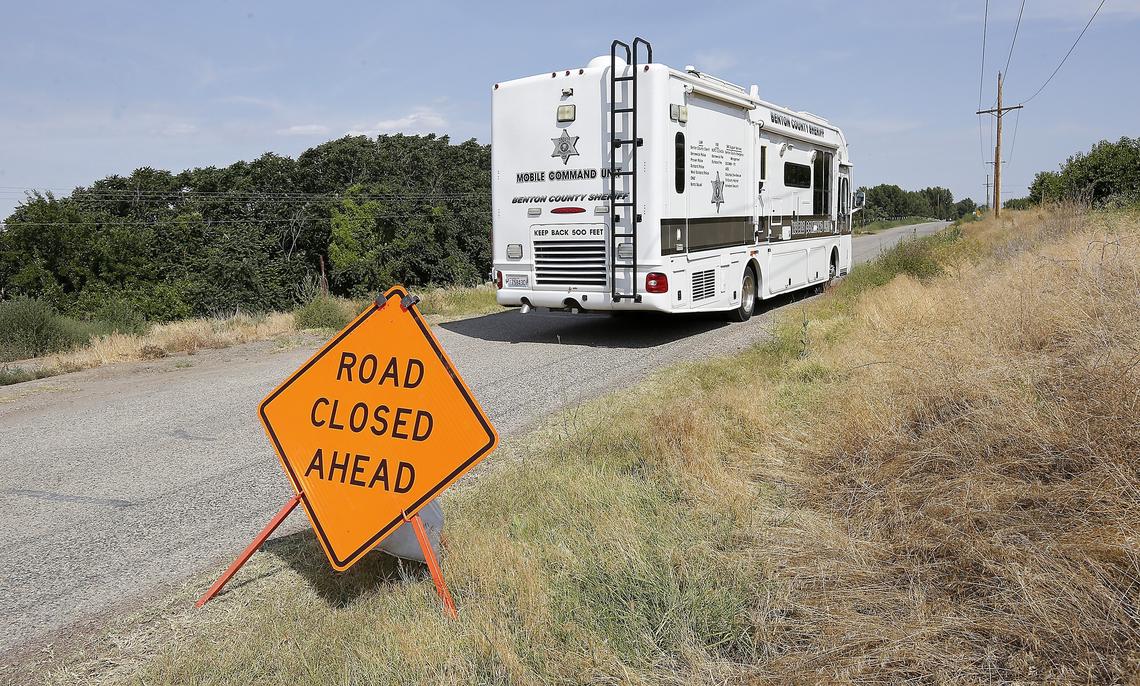 The Benton County Sheriff's Department mobile command unit drives near the end of Columbia River Road in rural Franklin County towards the scene where a decomposed body was discovered along the shoreline of the Columbia River.