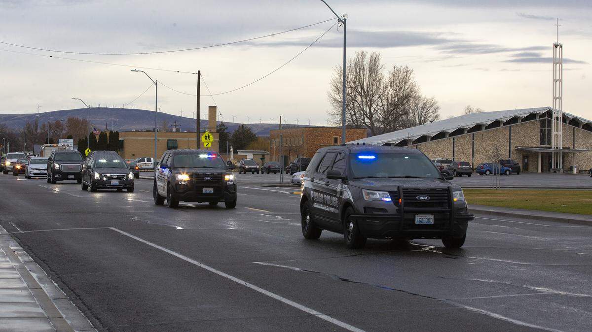 Franklin and Walla Walla county deputies lead a procession Thursday for Walla Walla County Commissioner Jim Duncan from St. Patrick’s Catholic Church in Pasco to Mountain View Cemetery in Walla Walla. Duncan 49, died last week after suffering cardiac arrest at his Burbank home. The father of four had been scheduled to be sworn in to a second term the day he died.