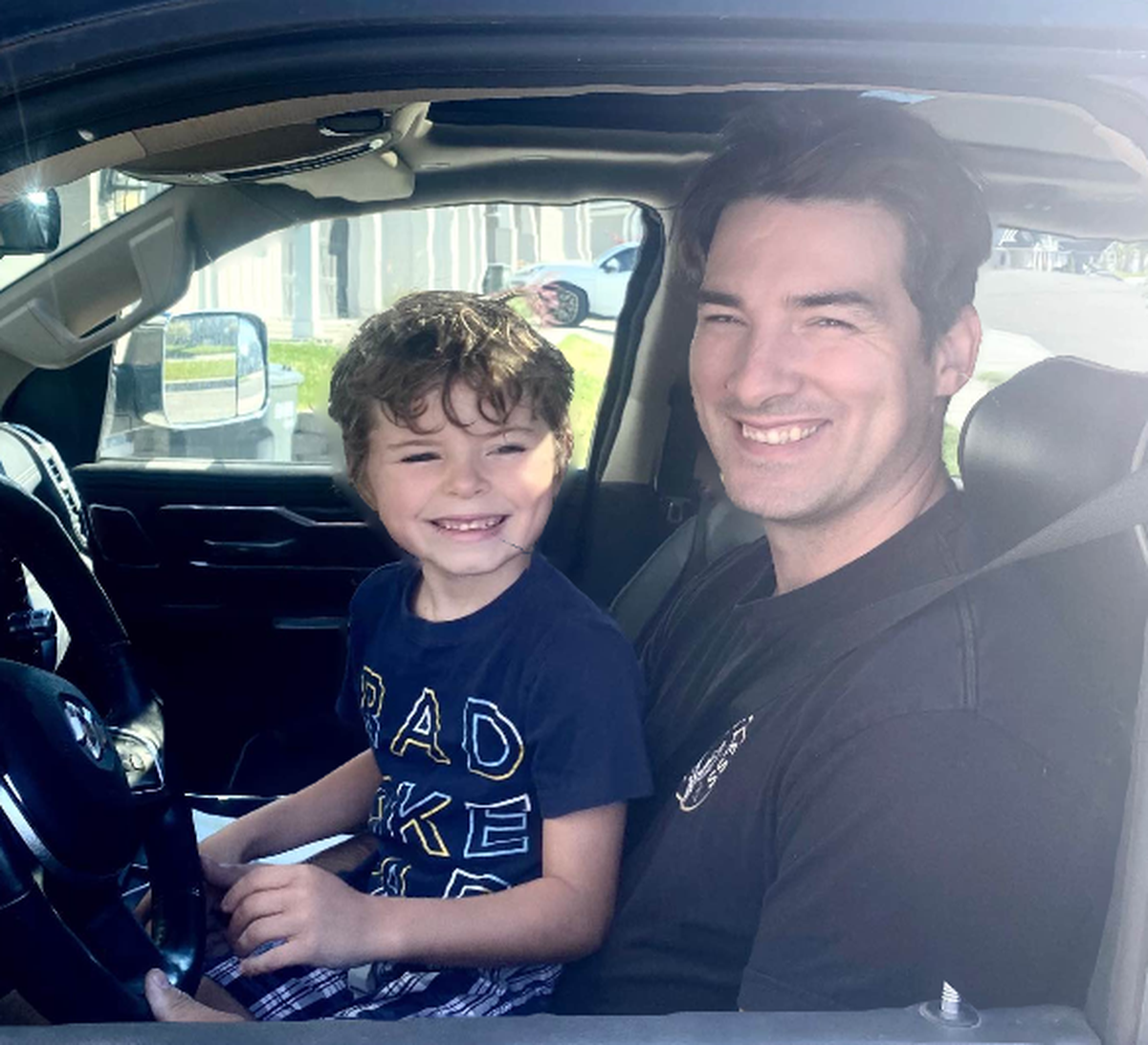 Kennewick Firefighter Shane Webb sits with his son on the day before his health deteriorated in June 2020. Now his family is hoping his story will convince people of the need to wear masks.