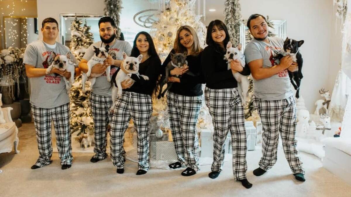 Rosio Avila Sanzon (third from right) with her children Ramon, Jacob, Miriam and Nelly, and her husband, Cesar, pose for a holiday photo. Sanzon, owner of the Pasco restaurant El Paraiso, died this month a few days after her brother.