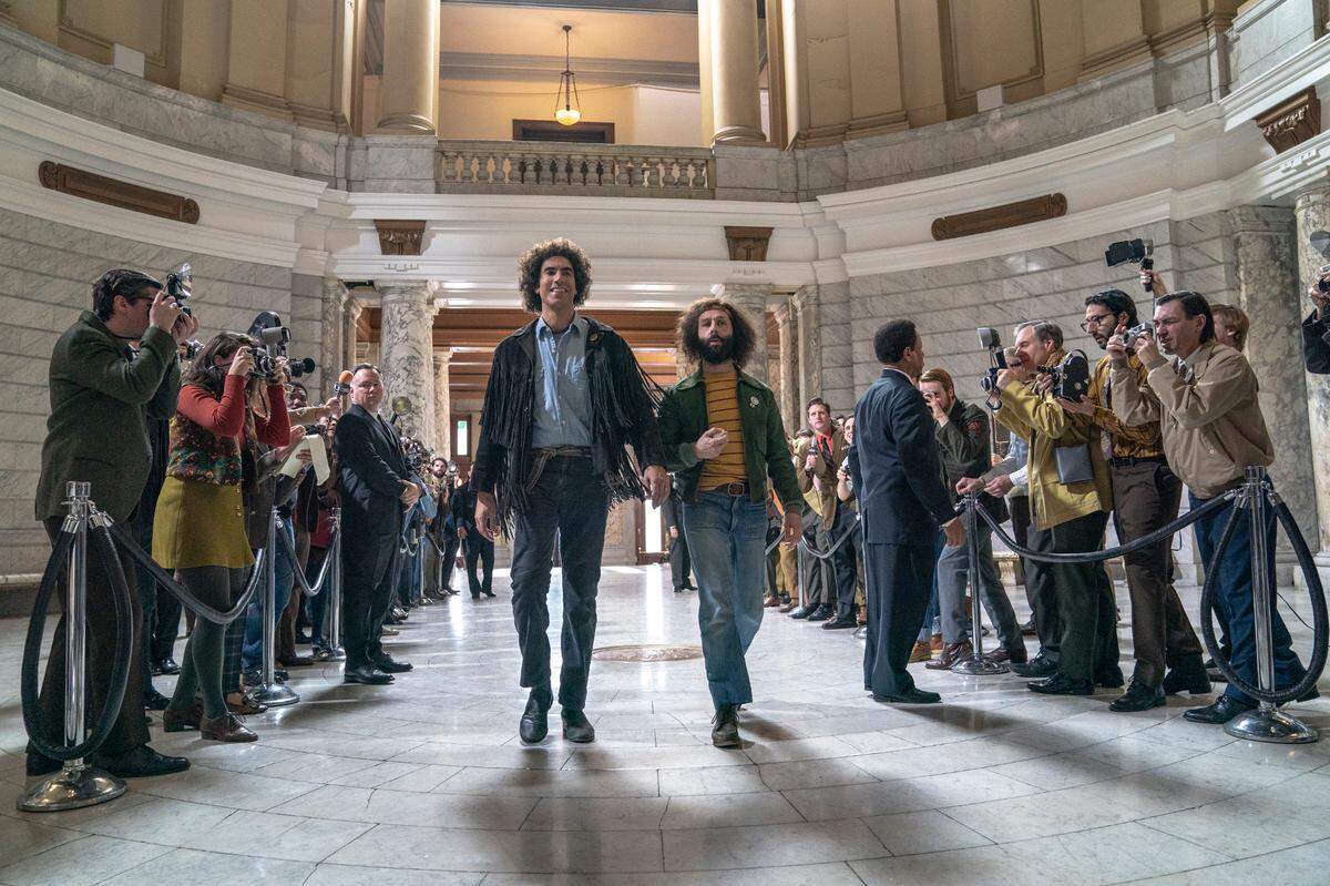 Sacha Baron Cohen and Jeremy Strong in “The Trial of the Chicago 7.”