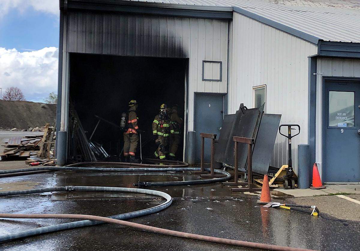 Firefighters battle a commercial fire on the 1300 block of E. 3rd Ave. near Chemical Drive that threatened several other businesses, according to dispatch reports.