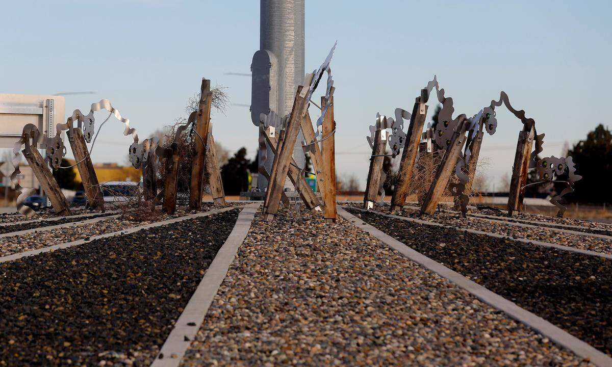 “Waves of Viticulture,” a low-slung metal piece inspired by the region’s vineyards, in the roundabout at Queensgate/I-182 interchange.