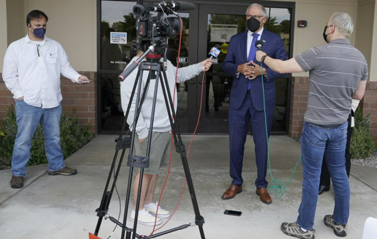 Washington Gov. Jay Inslee wears a mask as he talks to reporters, Thursday, June 2, 2022, outside a Dept. of Ecology office in Richland before a tour of the Hanford nuclear reservation.