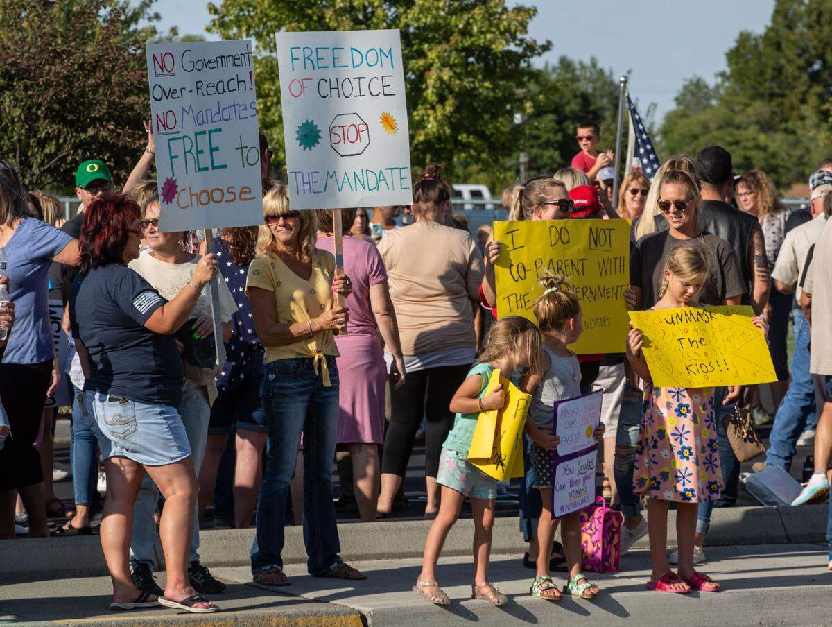Hundreds rallied in August 2021 outside the Kennewick School District administrative building before the start of the school year in protest of Gov. Jay Inslee’s state mask mandate.