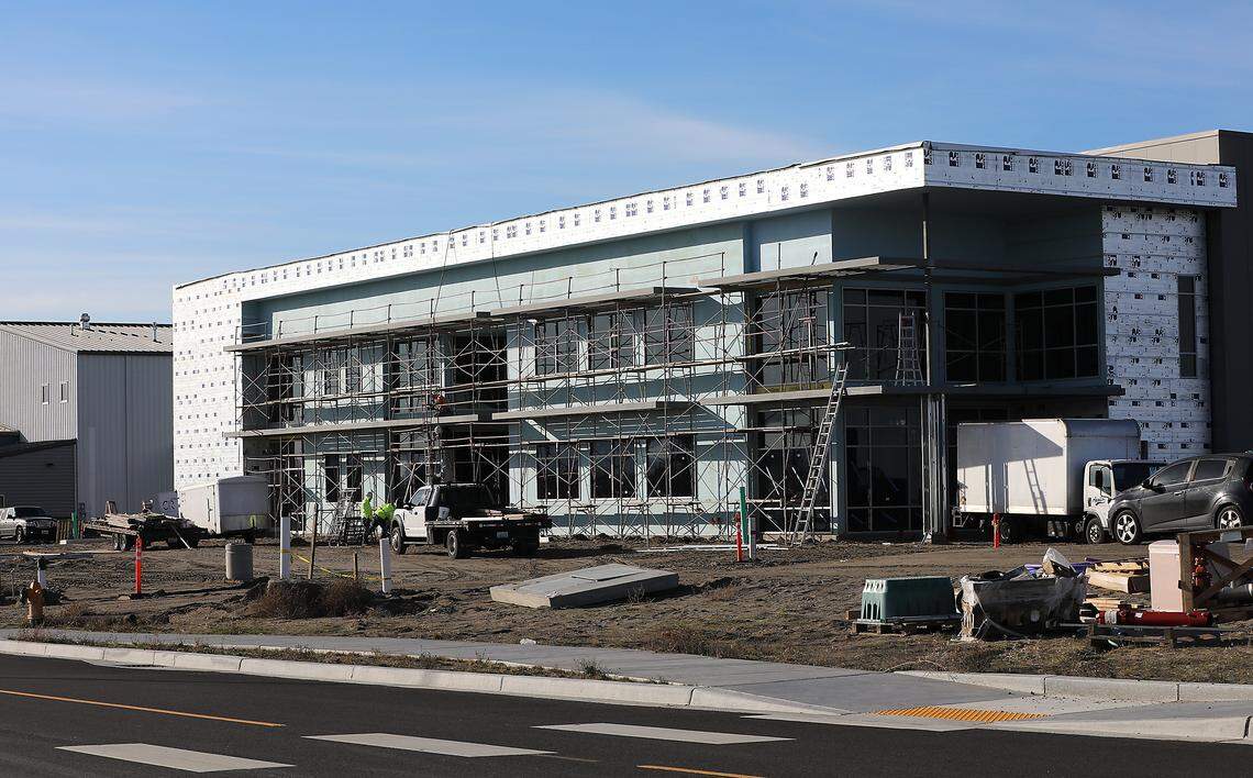 Construction crews work on a new building near the Tri-Cities Airport in Pasco. 