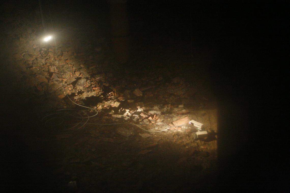 A 50-pound robot dubbed the crib crawler, viewed through a thick window in an old control room at Hanford, took pictures inside the highly radioactive Z-9 Crib containing plutonium contamination more than a decade ago.
