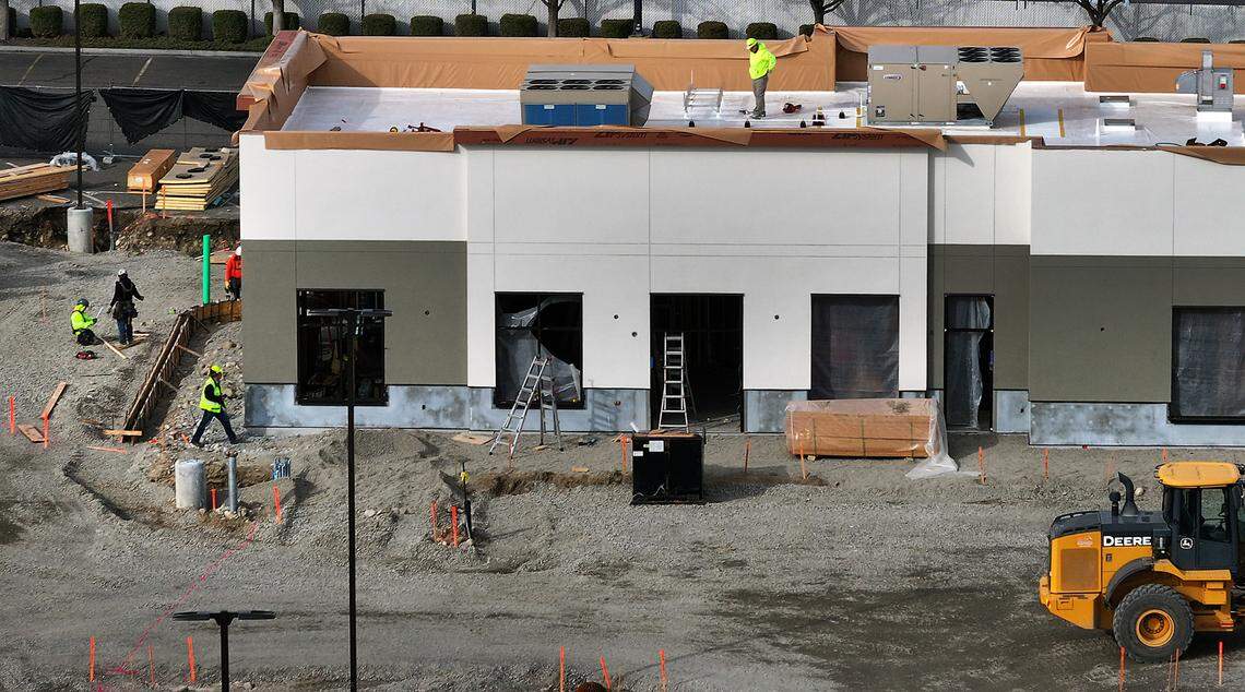 Crews work on roof and in the parking lot area at the new -square-foot Chick-fil-A restaurant at 7009 W. Canal Drive in Kennewick. Photo taken on March 5, 2025.