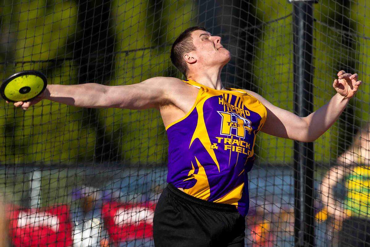 Hanford’s Tyler Melvin, a senior, throws the discus during a track meet Thursday, March 26. Melvin placed second in the boys discus with a throw of 132 feet, 5 inches, a personal best that improved his previous mark by 12 feet.