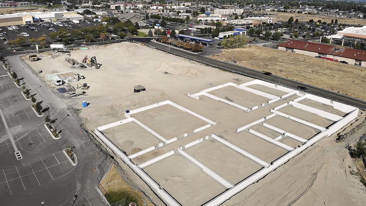 A drone’s eye view shows the concrete foundation layout for the new 10-screen Fairchild Cinemas building Wednesday in the 2900 block of South Quillan Street in Kennewick. The cinema will have reclining seats and sell alcohol, traditional movie concession snacks and entree items. The Tri-Cities company also operates cinemas in Pasco, Richland and Moses Lake..