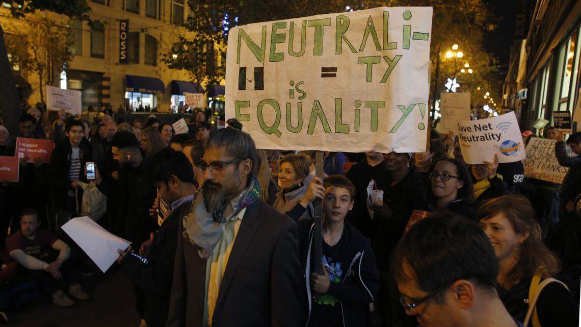 Protesters fighting to save net neutrality rally outside the Verizon store on Market Street in San Francisco, Calif., in December 2017. Senate Democrats are making a last-ditch effort to overturn the FCC decision to repeal net neutrality rules.