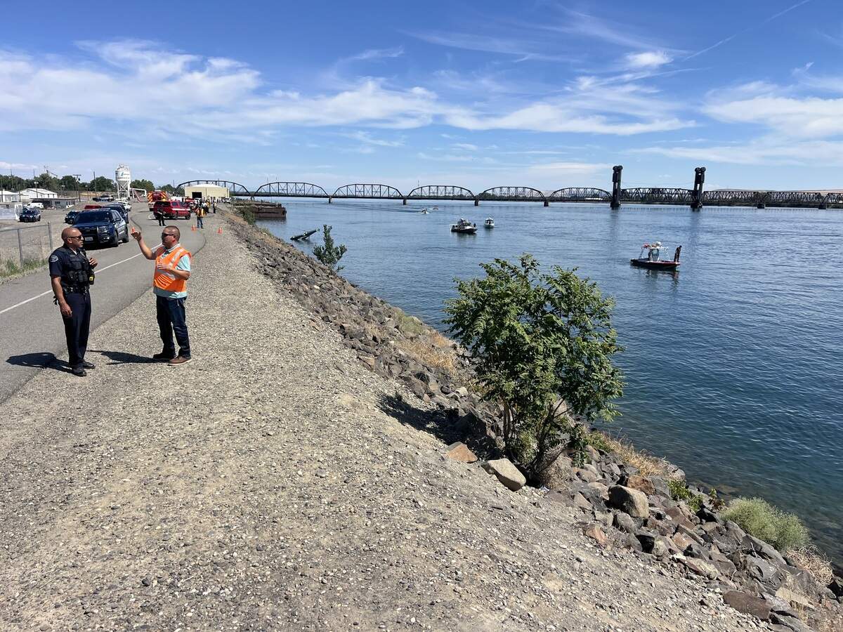A plane clipped a power line over the Columbia River to Clover Island on Wednesday afternoon and landed upside down in the water. Rescue crews are working to free anyone inside.