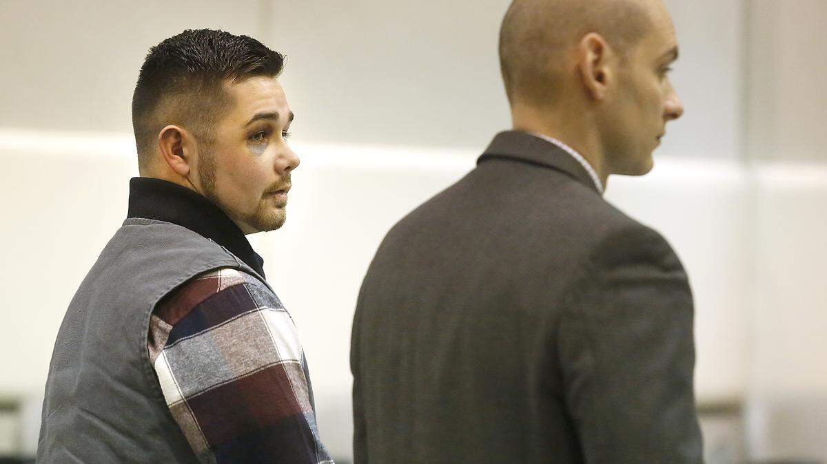 Zachary E. Gray, 20, left, stands with provisional defense attorney Caleb DiPeso Friday during a hearing about charges of third-degree assault and two counts of second-degree assault in Benton County Superior Court.