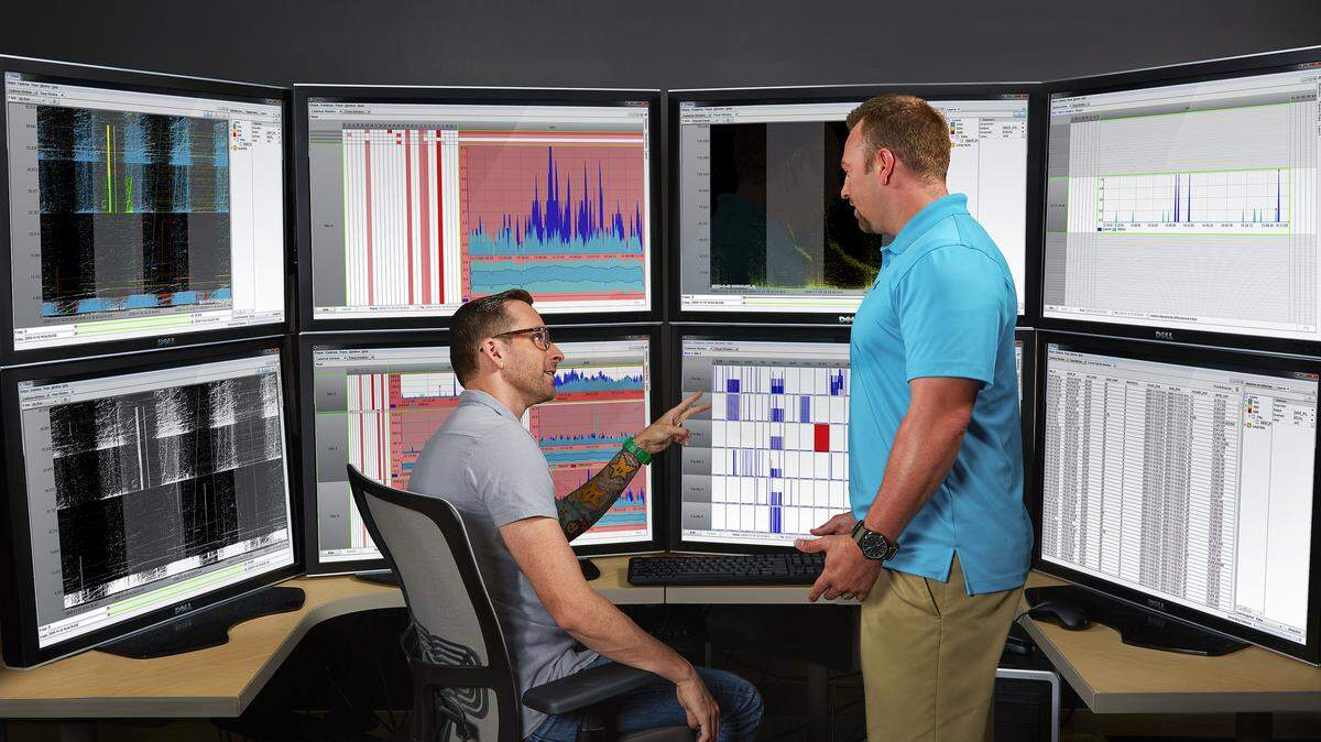 PNNL’s Bryan Olsen (right) and Dan Best, formerly of PNNL, developed a tool called CLIQUE, which helps analysts detect and assess potentially malicious events in large amounts of streaming computer network traffic. Cybersecurity experts at the lab are making it easier for analysts to identify patterns and spot potential cyber threats.