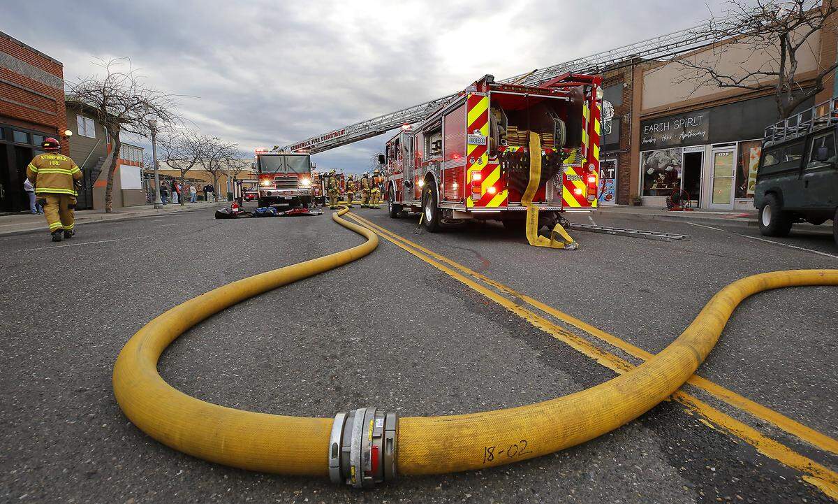Firefighters from around the Tri-Cities work early Tuesday morning to extinguish a fire at the El Tequilas Restaurant in downtown Kennewick.