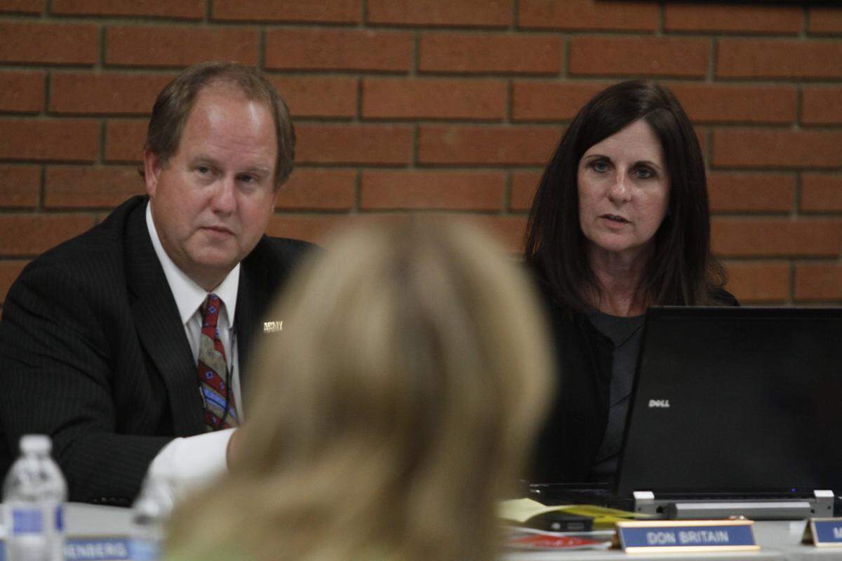 Kennewick city manager Marie Mosley and Mayor Don Britain listen at a city council workshop.