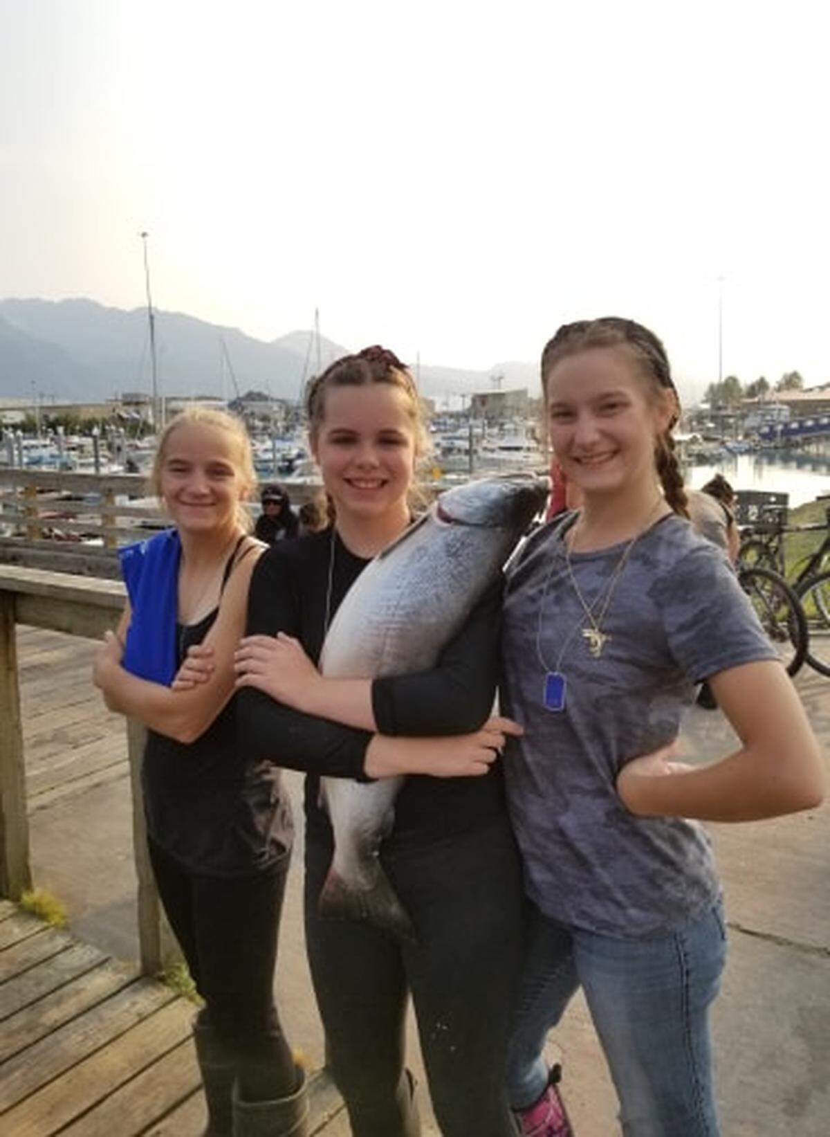 Maleah Chapin, 12, holds the silver salmon that took top prize in the Valdez, Alaska, Silver Salmon Derby.