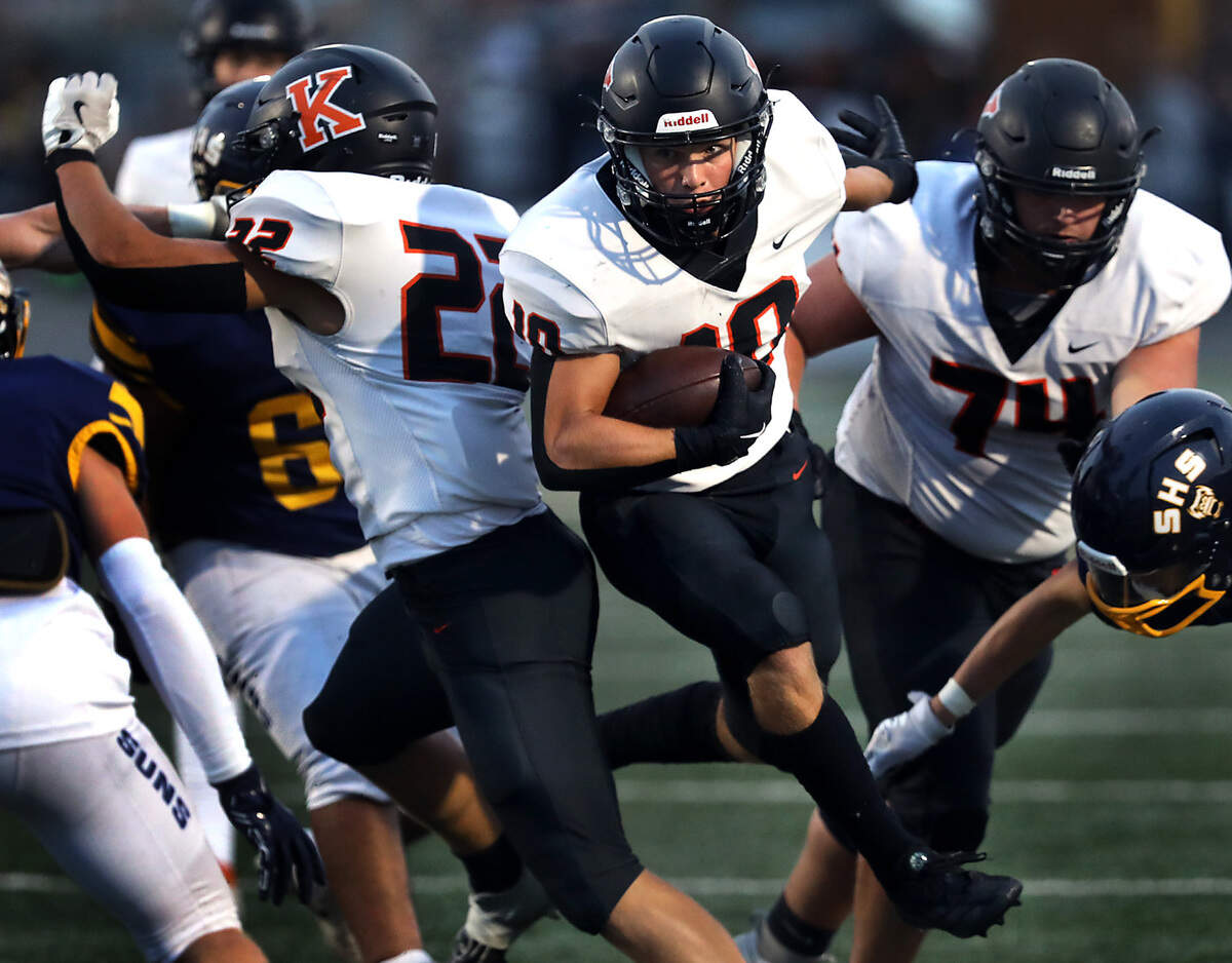 Kennewick running back Canaan Hays squirts past his blockers for a gain during Friday Sept. 13, 2024 game against Southridge at Lampson Stadium in Kennewick.