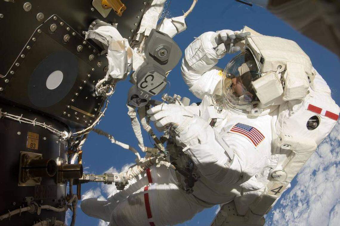 NASA astronaut Tom Marshburn participates in his first spacewalk at the International Space Station, July 20, 2009.