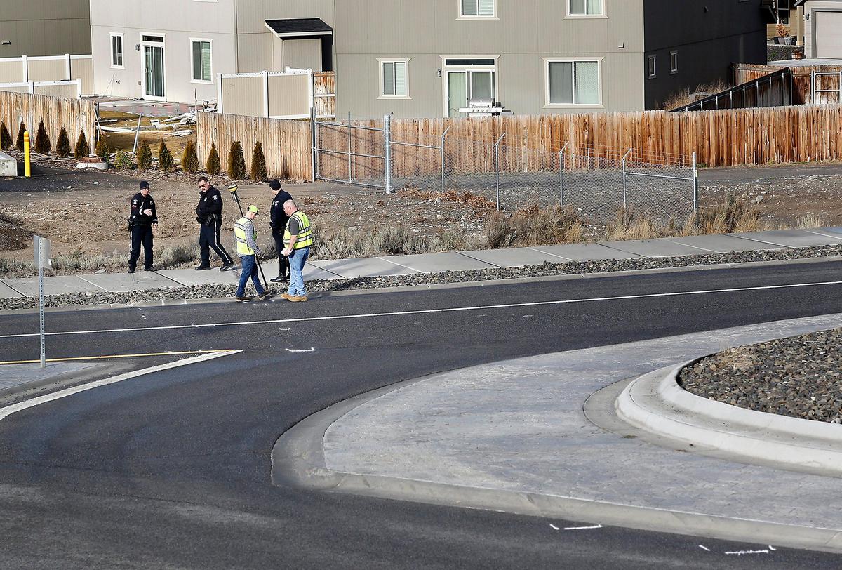 Kennewick city surveyors help Kennewick police measure the site of a deadly crash at the roundabout on Steptoe Street and West 10th Avenue. Bricia Villasenor-Botello, 29, of Pasco, a restaurant assistant manager at Panda Express, was driving west on 10th in a Jeep when she drove the wrong-way at the roundabout, launched across a creek and crashed through fences along West Ninth Place. Police initially do not suspect alcohol was involved but a sample of her blood was sent for testing, said Sgt. Matt Newton. Watch a video at: tricityherald.com