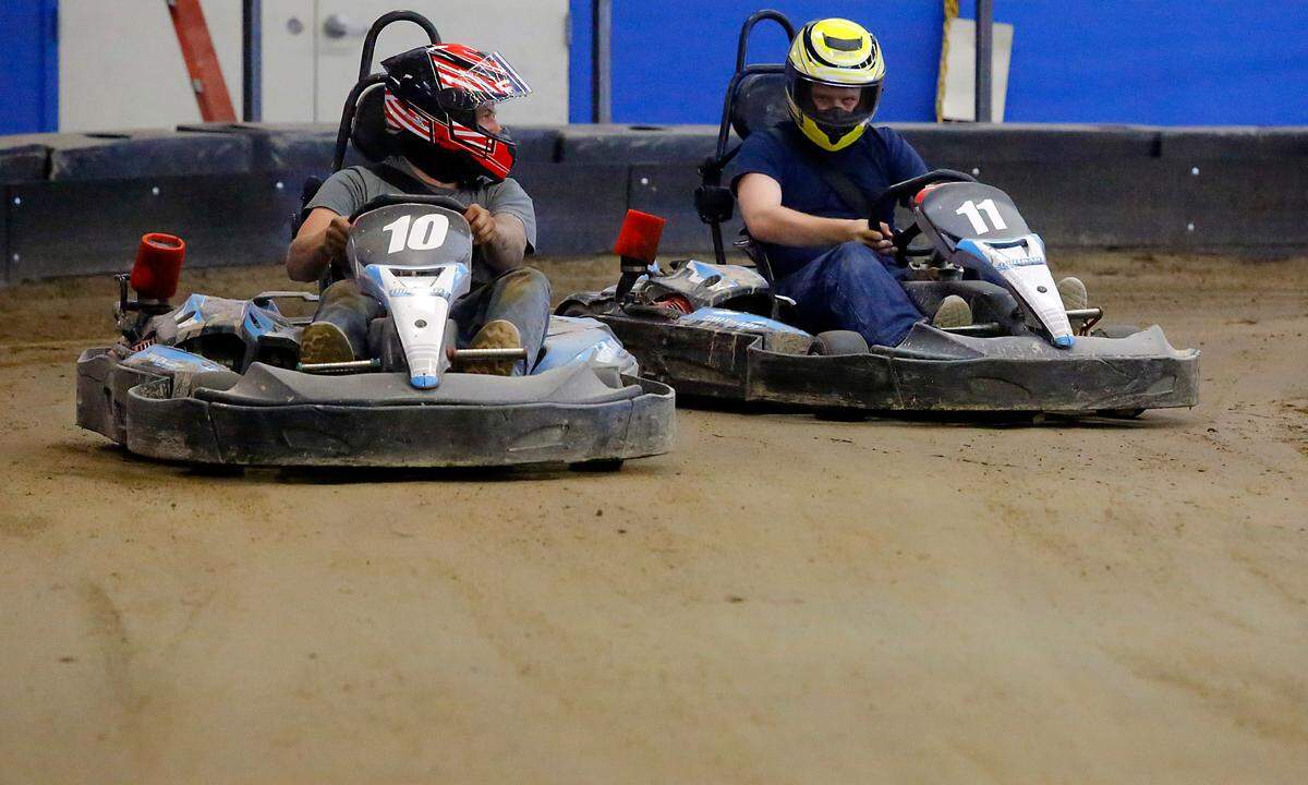 Mechanic Jauston Davis, left, and general manager David Johnson test the go-karts on the indoor dirt race track called DirtKart at 2203 West Fourth Ave. in Kennewick. The new business is preparing to open in time for Water Follies and other summer events held in the Tri-Cities.