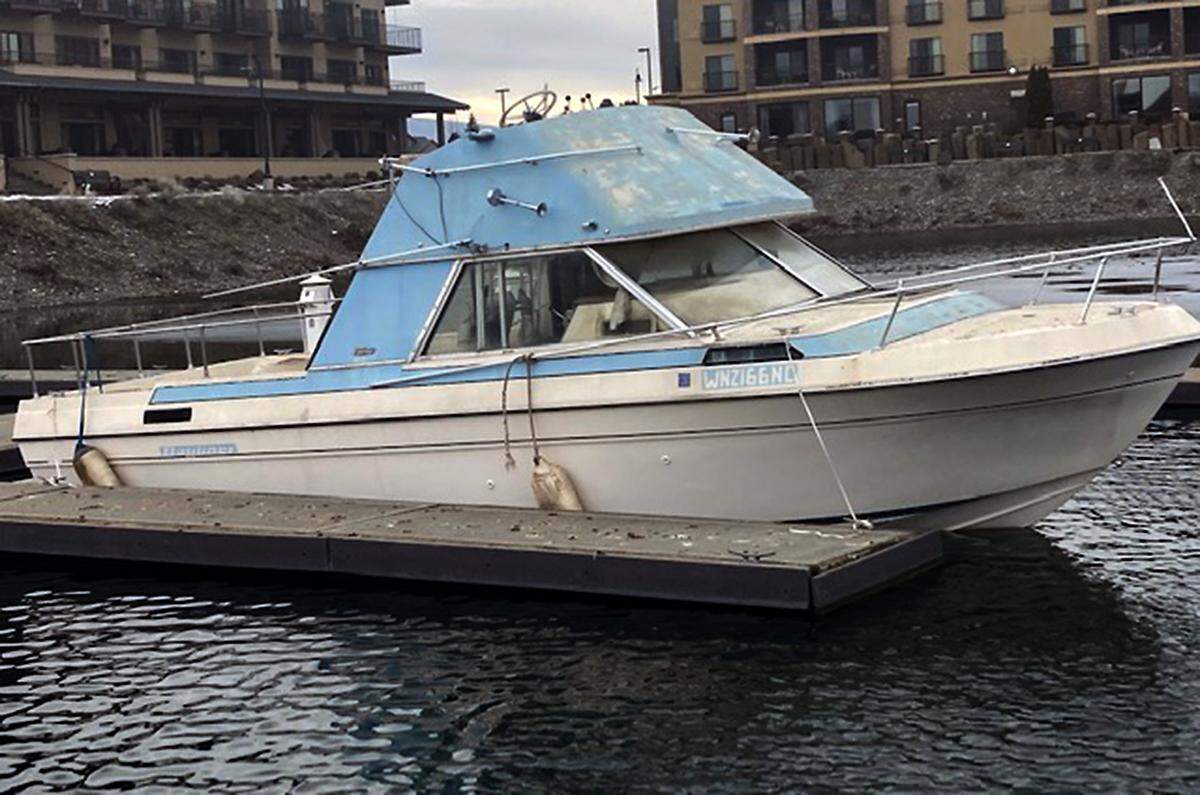 The cabin cruiser that capsized Thursday morning is shown moored at the public docks at Columbia Point Marina Park in Richland the day before sinking.