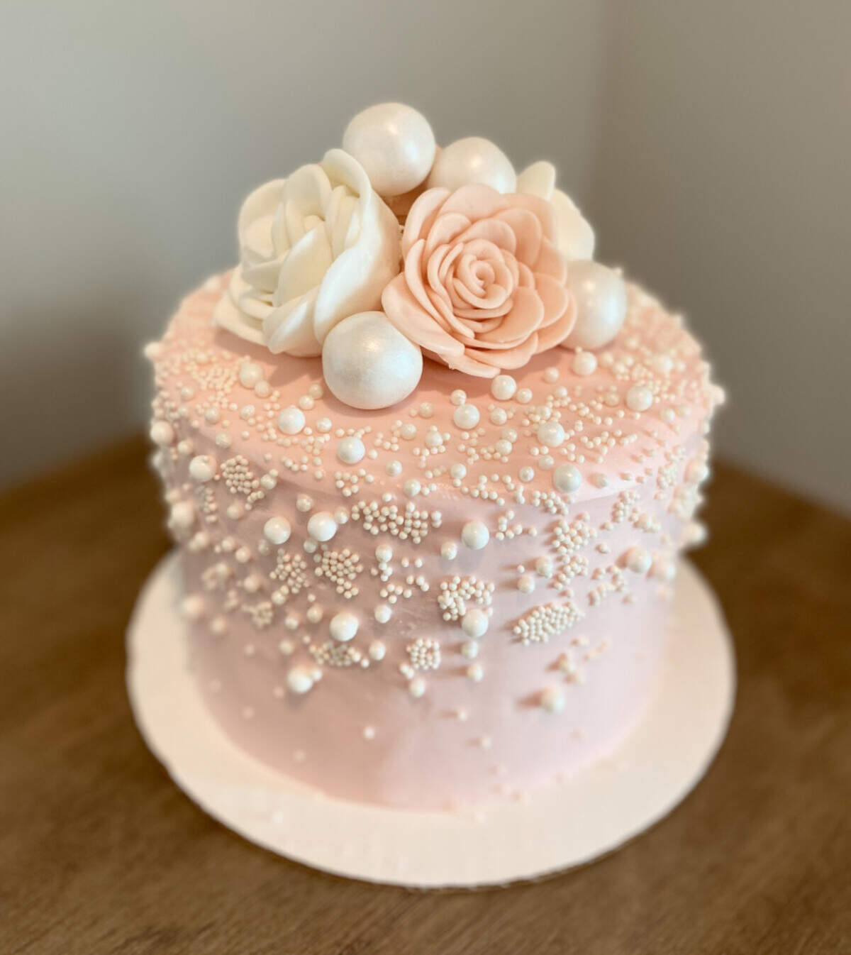 A pink floral and intricate pearl cake is one of 100-plus creations that has earned Katrina Jackson of Pasco a spot in the semi-finals of “The Greatest Baker” competition. Voting for the next phase is open until June 24.