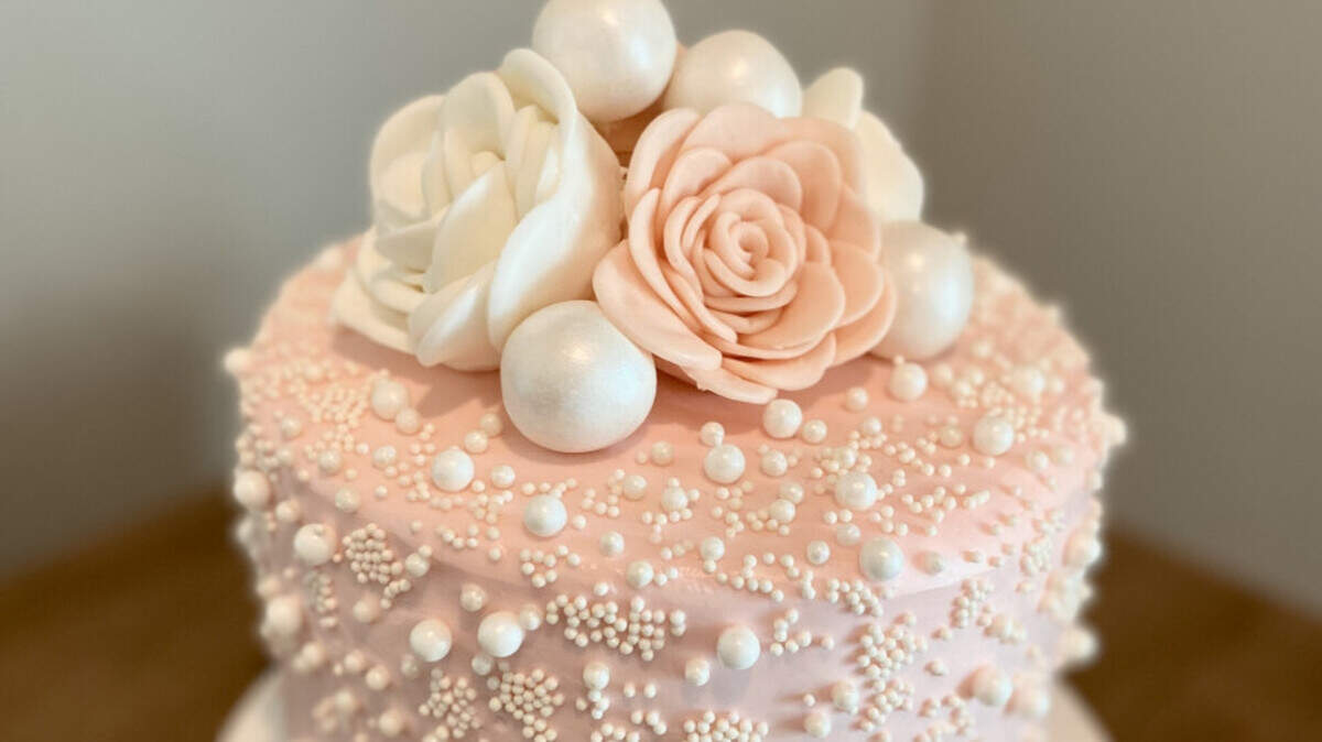 A pink floral and intricate pearl cake is one of 100-plus creations that has earned Katrina Jackson of Pasco a spot in the semi-finals of “The Greatest Baker” competition. Voting for the next phase is open until June 24.