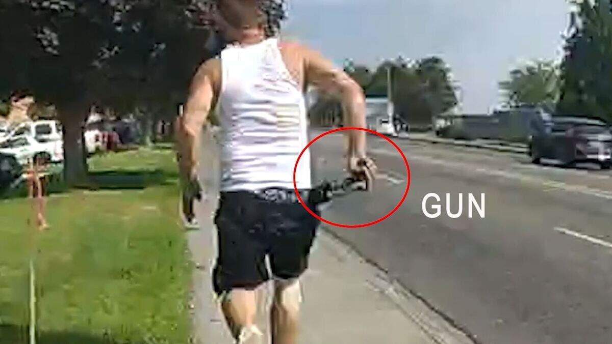 James Dean West pulls out a gun from the back of his pants during an Aug. 22 chase on Columbia Center Boulevard.
