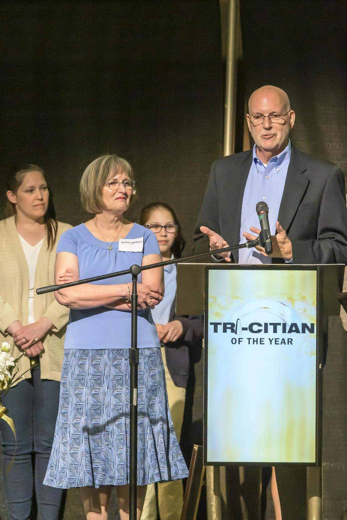 Mark Brault, the volunteer chief executive of Grace Clinic, was named Tri-Citian of the Year for 2022. His family, including wife, Kathy, were there when he was surprised with the award.
