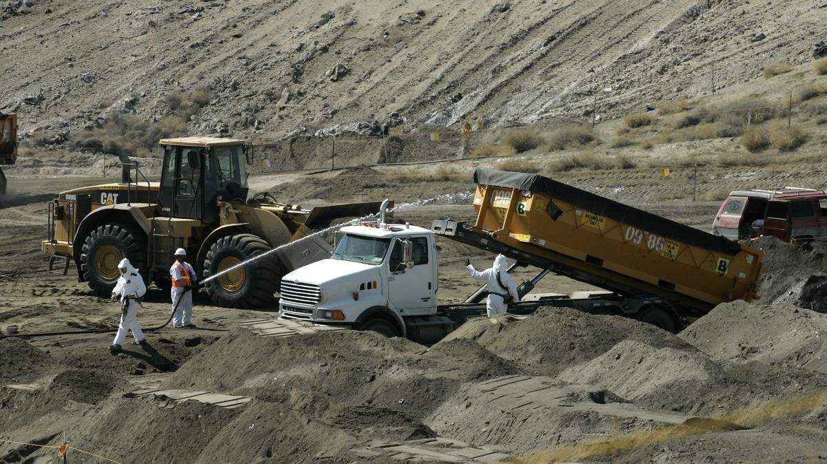 The U.S. Senate passed a Hanford spending bill on Monday that would provide $2.4 billion for environmental cleanup work at the Hanford nuclear reservation. Workers are shown unloading contaminated debris into a lined landfill.