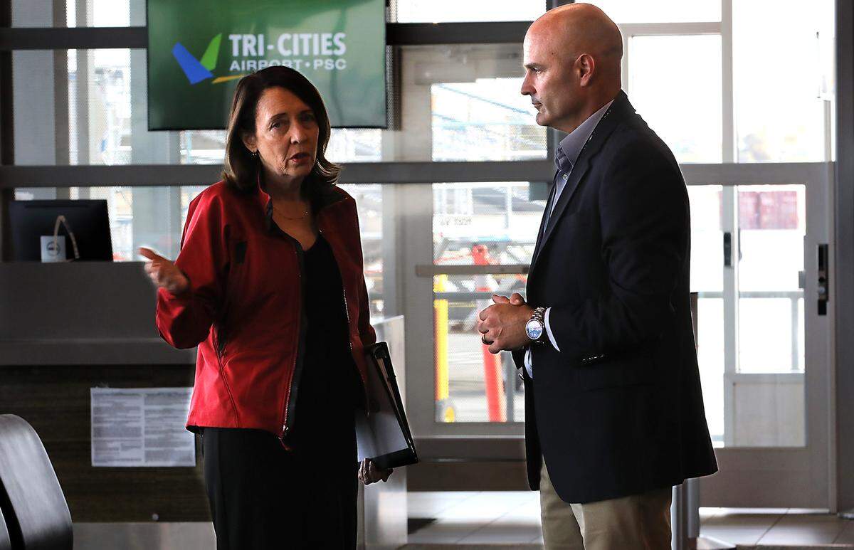 Buck Taft, Tri-Cities Airport director, guides Sen. Maria Cantwell on a tour of the airport terminal in Pasco.