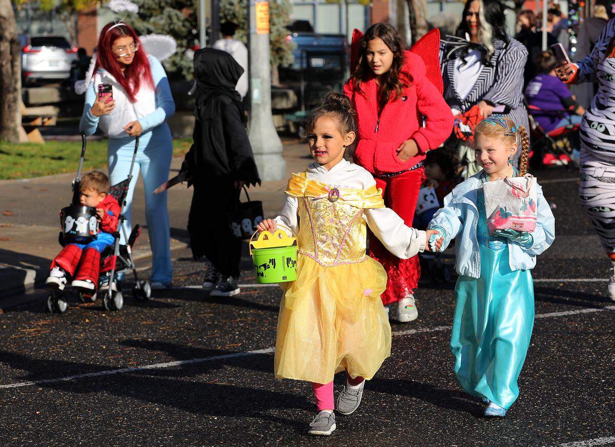 Hundreds of trick-or-treaters take part in the annual Downtown Kennewick Halloween Boo Bash. Business owners open their doors and hand out treats to the crowds that line up on Kennewick Avenue.