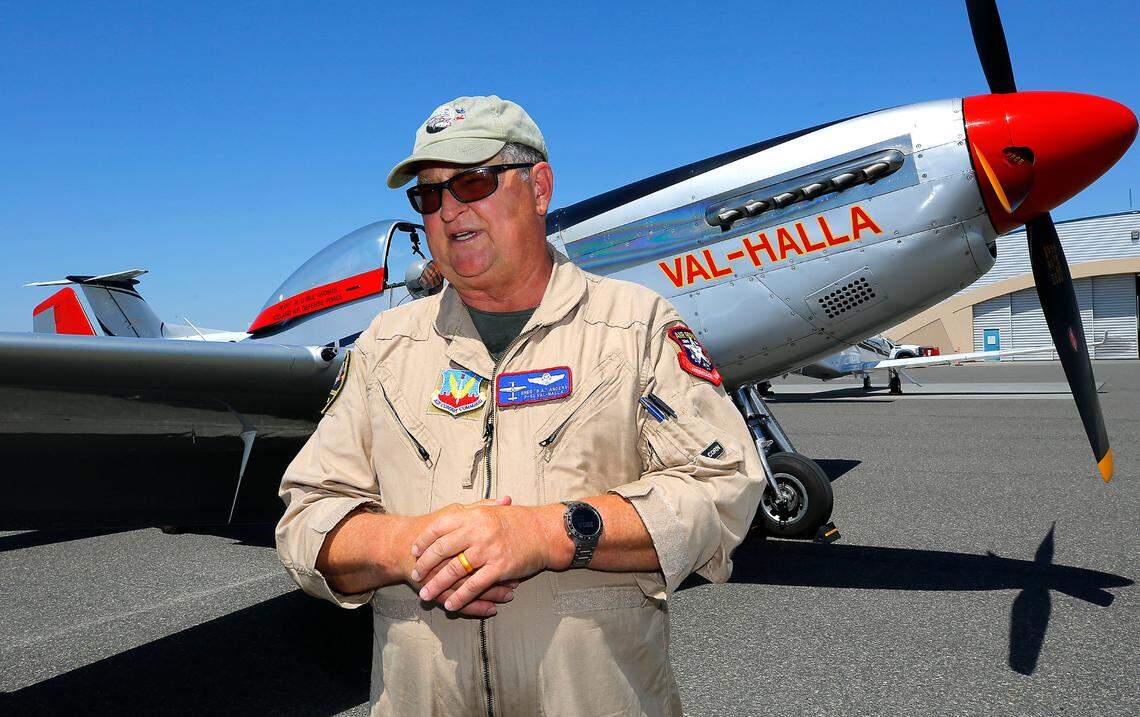 Pilot Greg Anders stands near his WWII era P-51 Mustang nicknamed “Val-Halla” after landing Thursday at the Tri-Cities Airport in Pasco.