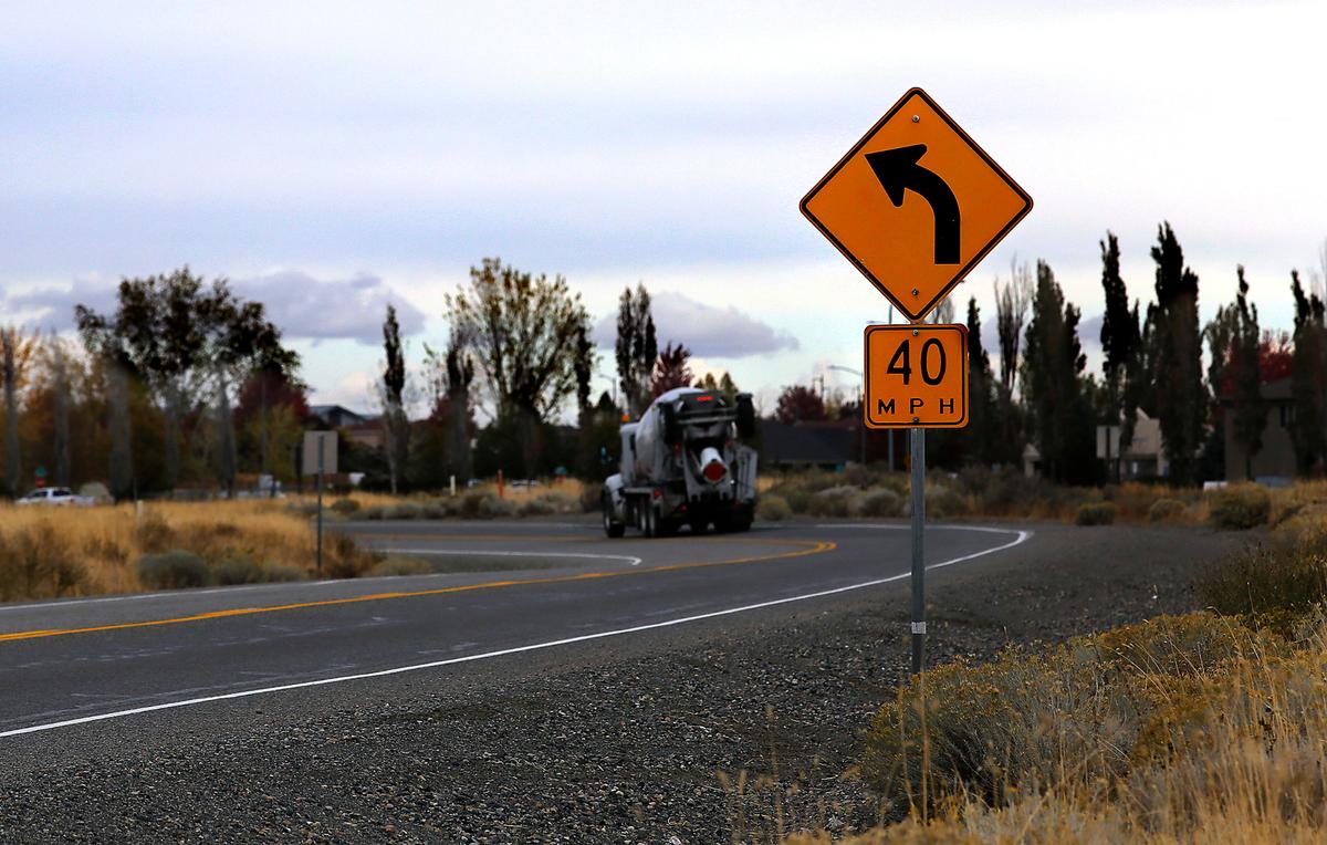 A truck hauling concrete heading eastbound on Harris Road rounds a corner as it approaches Broadmoor Boulevard in west Pasco.