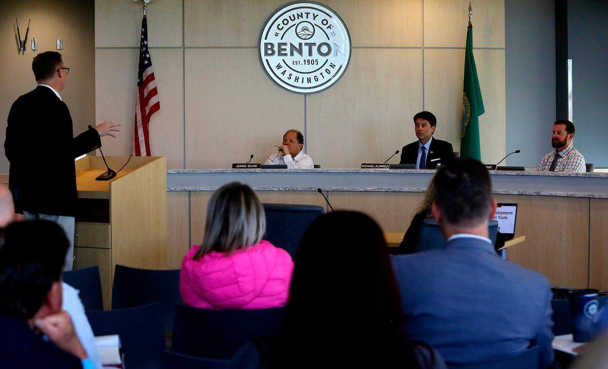 The Benton County Commissioners hold a meeting in the administrative building in Kennewick. commissioners Jerome Delvin, Michael Alvarez and Will McKay, from left.