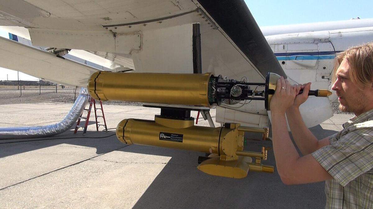 PNNL Earth scientist Jason Tomlinson installs a freshly calibrated instrument into its casing in preparation for a research flight. In addition to a payload chock full of scientific instruments, the research aircraft’s wings are also equipped with a variety of instruments that measure cloud and aerosol properties in support of the Department of Energy’s Atmospheric Radiation Measurement user facility. Image courtesy of the U.S. Department of Energy Atmospheric Radiation Measurement (ARM) user facility.