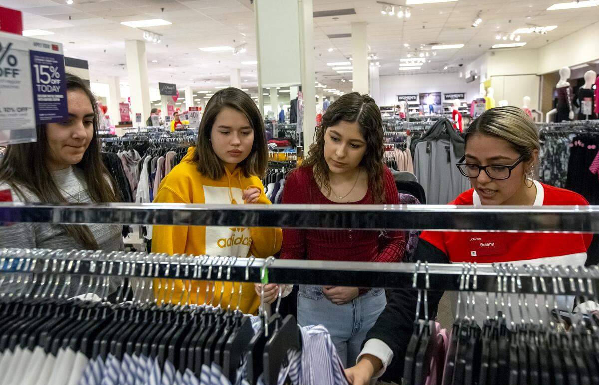 Teens from the Boys & Girls Clubs of Benton and Franklin Counties shop for professional clothes at JC Penney in Kennewick thanks to local police and sheriff foundations.