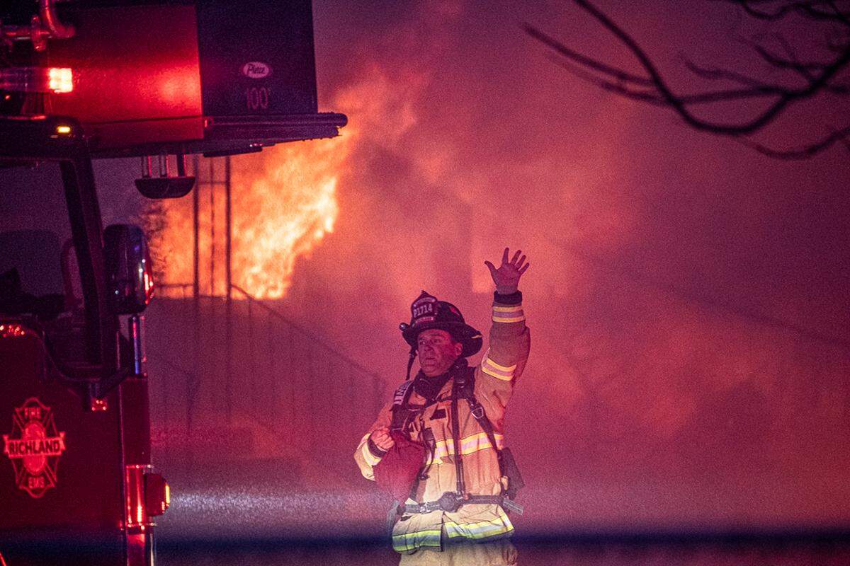 Richland firefighters battled a 3-alarm duplex fire on Stevens Drive on Monday night. A mother and disabled son escaped unharmed.
