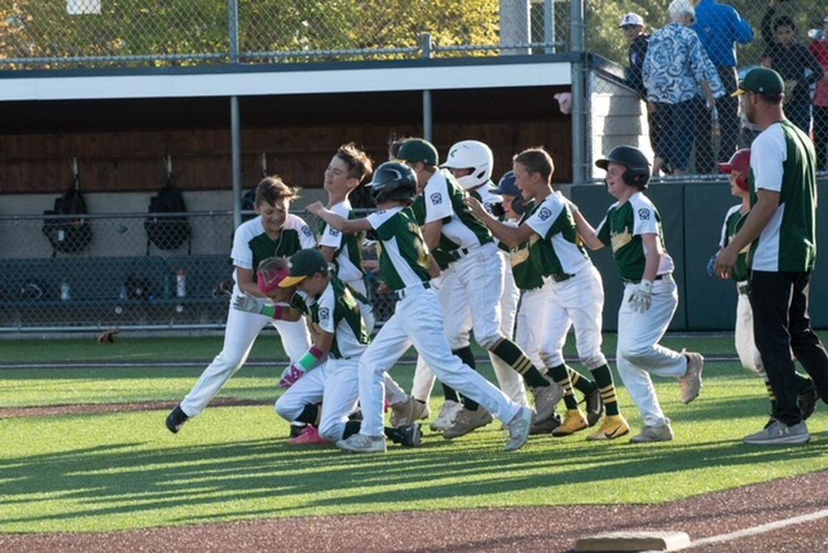 The Richland National Little League all-stars celebrate their state title on July 29 in Anacortes.