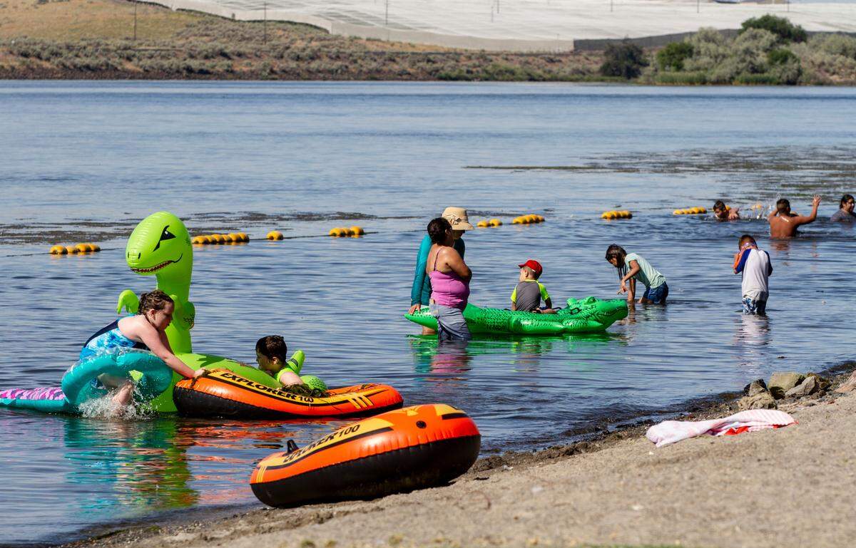 People beat the heat in Hood Park along the Snake River near Pasco.