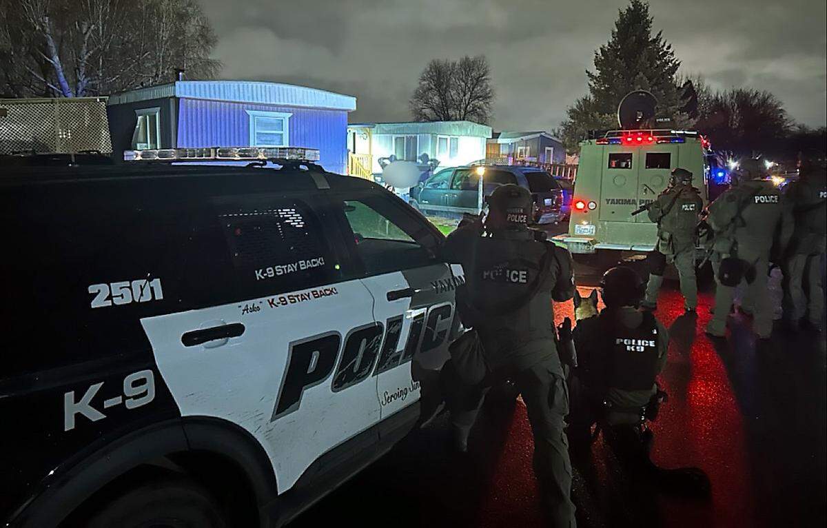 Members of the of the Union Gap Police Department, Yakima Police Department, Yakima County Sheriff's Office, and Yakima Valley Crisis Response Unit, our Major Crimes detectives and Criminal Apprehension Team (CAT) assist Kennewick Police Detectives take a 15-year-old murder suspect into custody Tuesday in Union Gap.